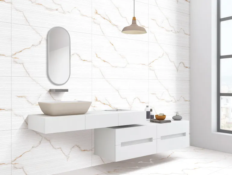 Linea Statuario Gold Vein marble bathroom design with countertop sink and stylish mirror